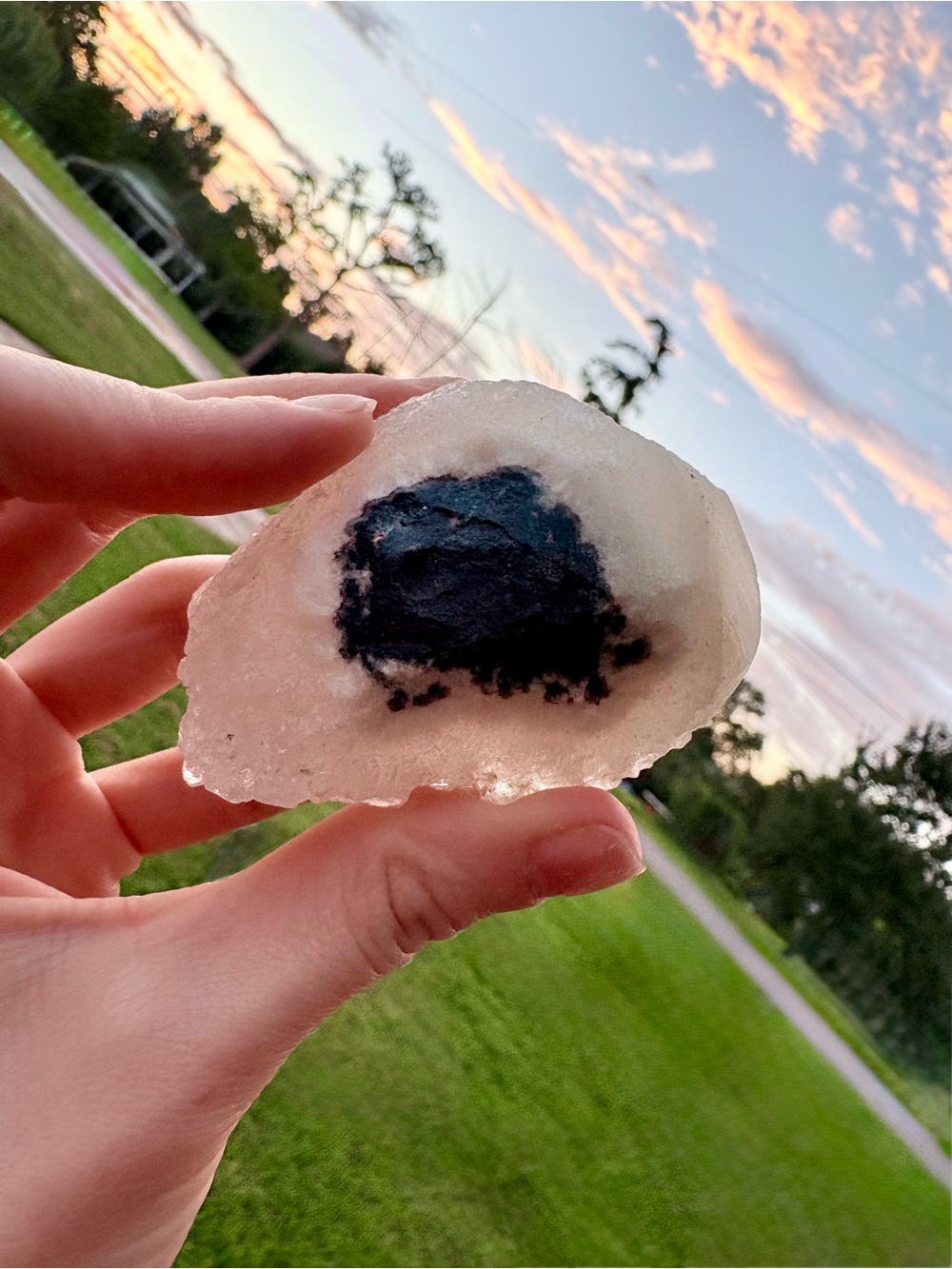 Handheld Clear Geode Slice with Dark Blue Center